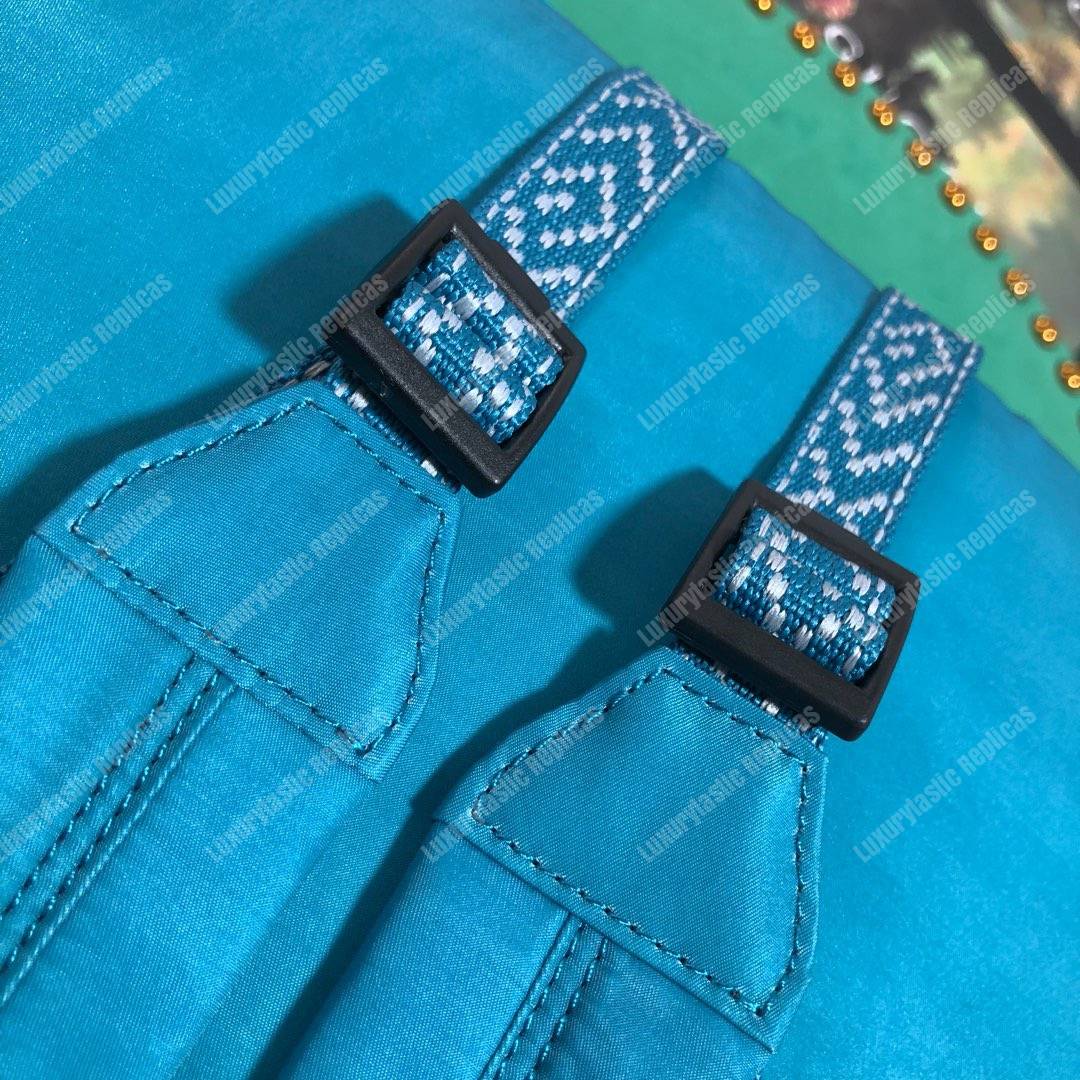 G*u*i medium backpack with G*u*i ’80s patch light blue