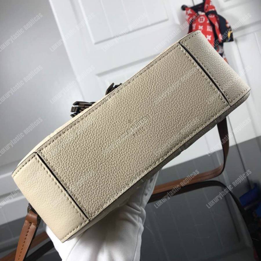 LV Saintonge Monogram Empreinte Leather Creme Caramel