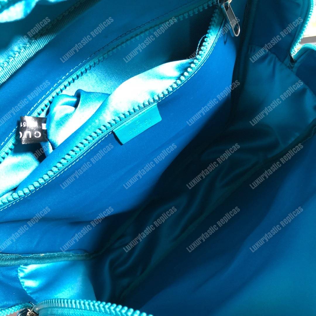 G*u*i medium backpack with G*u*i ’80s patch light blue
