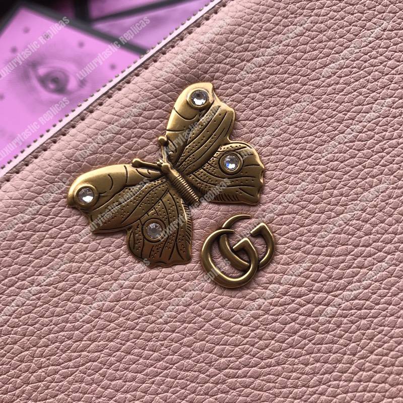 G*u*i leather pouch with butterfly pink