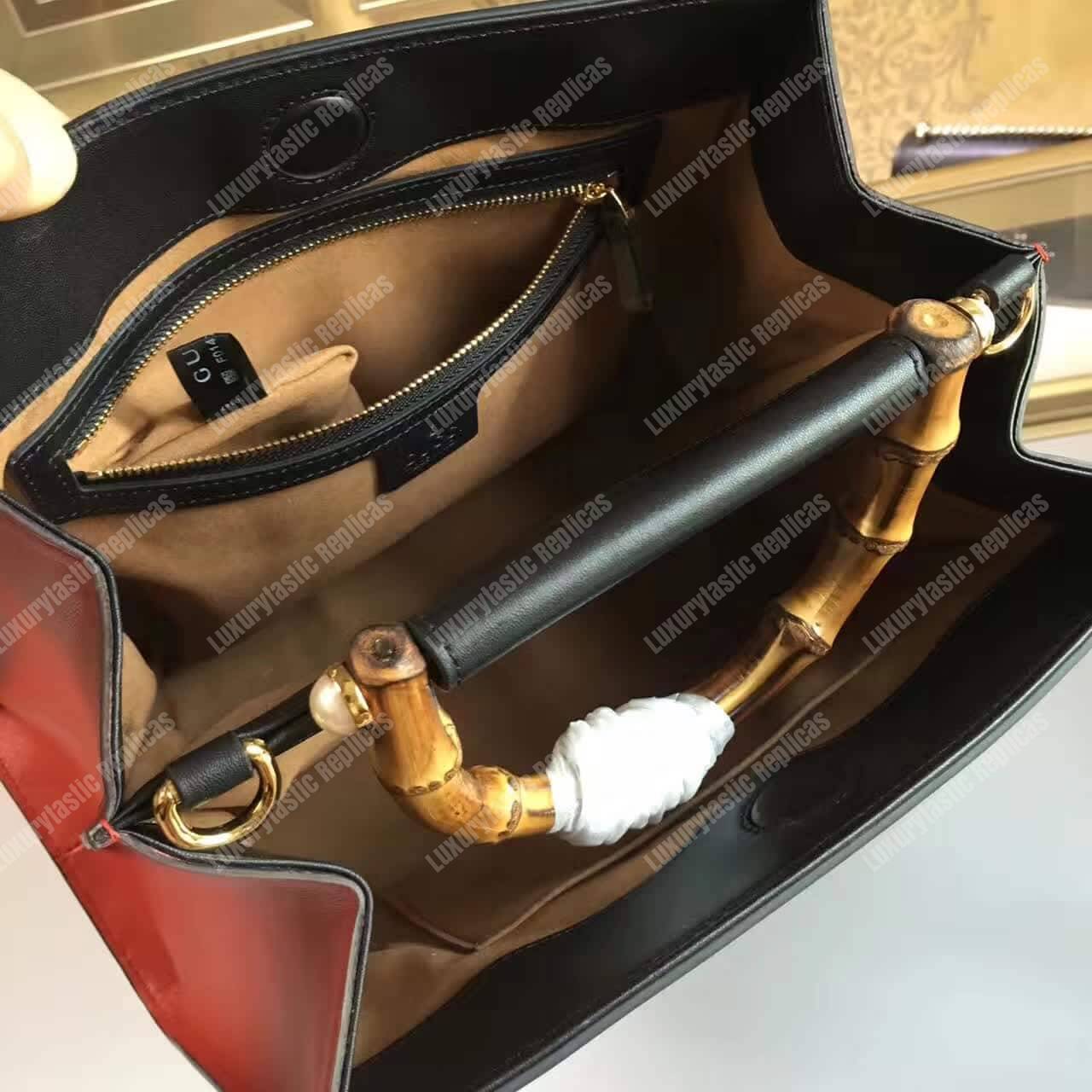 G*u*i nymphaea leather top handle bag