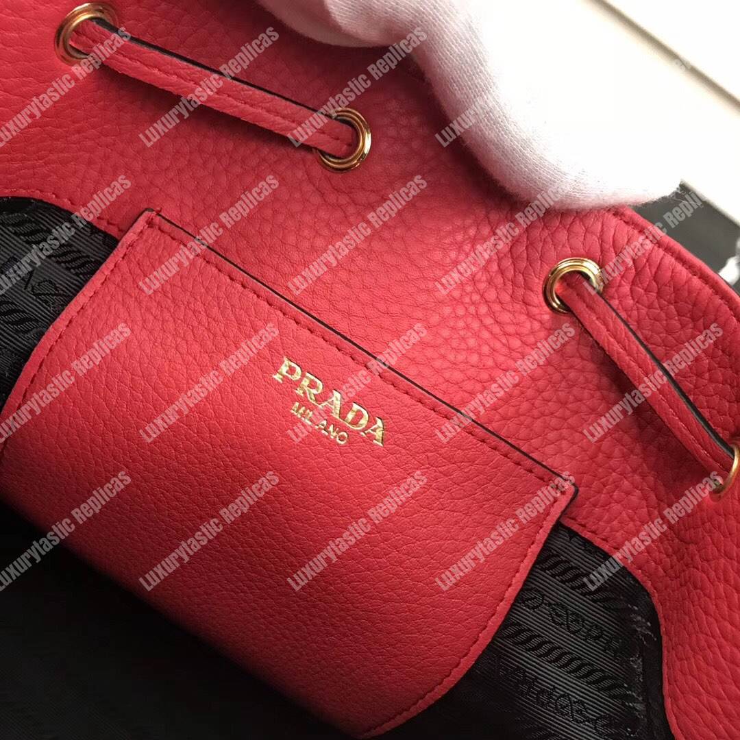 Pra*a leather bucket bag red