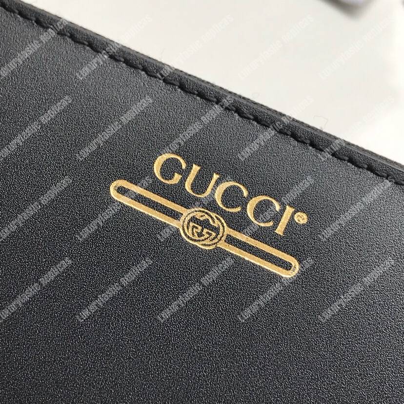 G*u*i leather zip around wallet with G*u*i logo