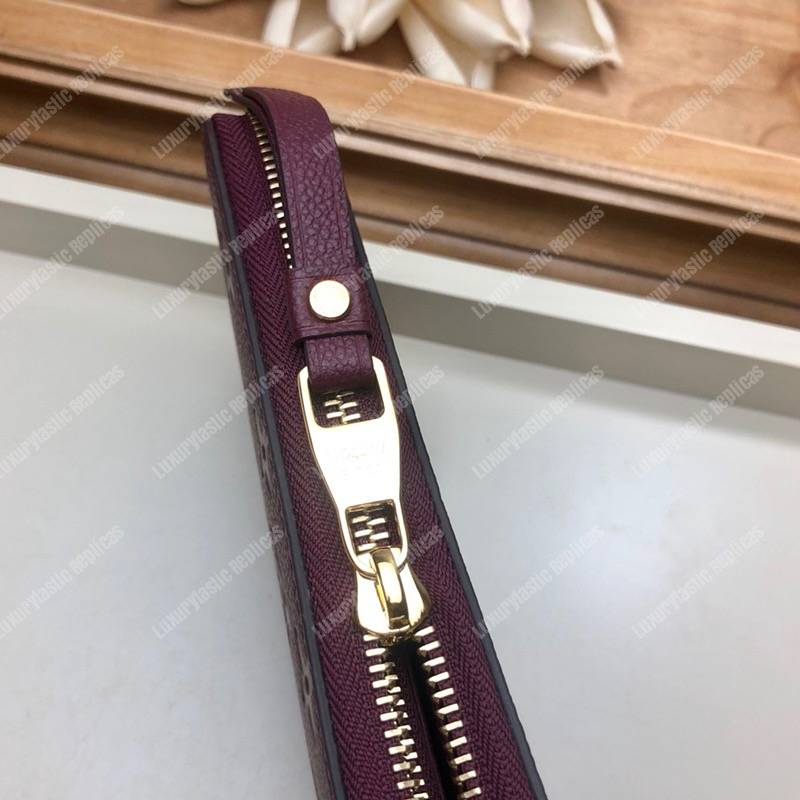 LV Clémence Wallet Monogram Empreinte Leather Raisin