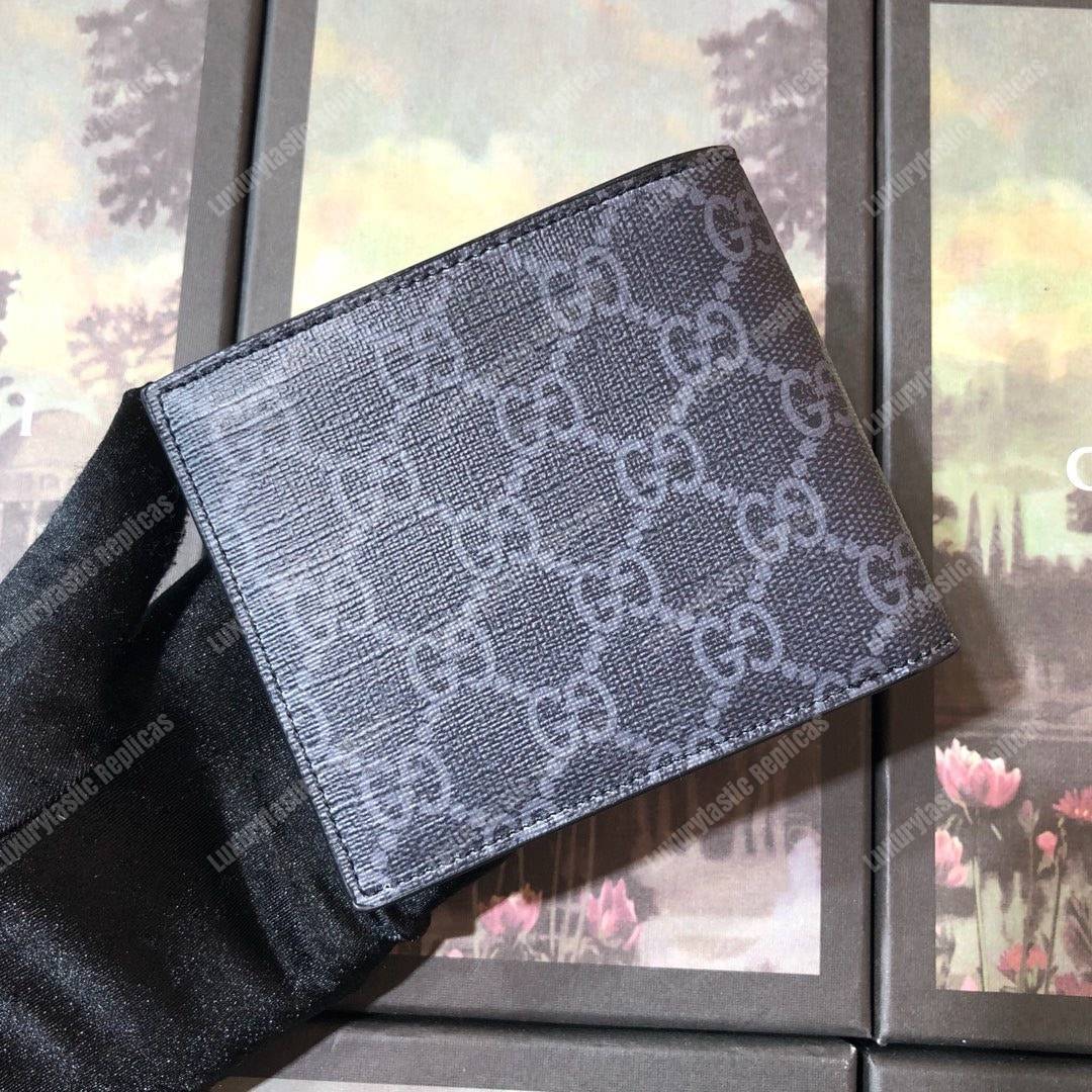 G*u*i gg sup*e wallet with wolf