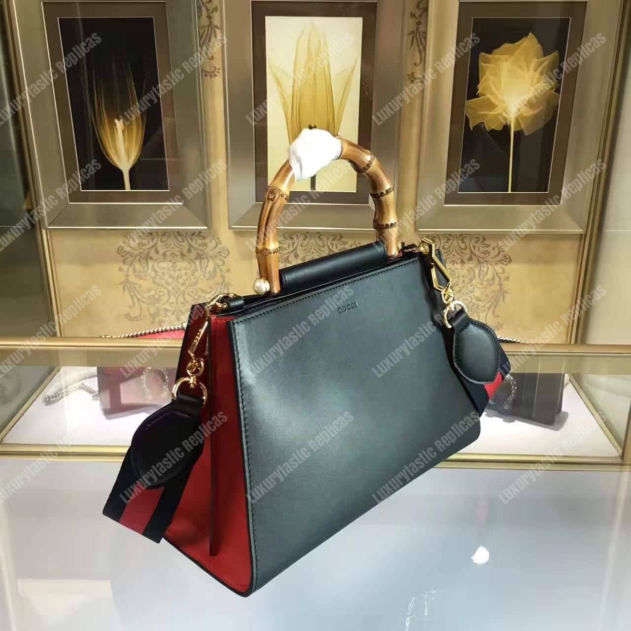 G*u*i nymphaea leather top handle bag