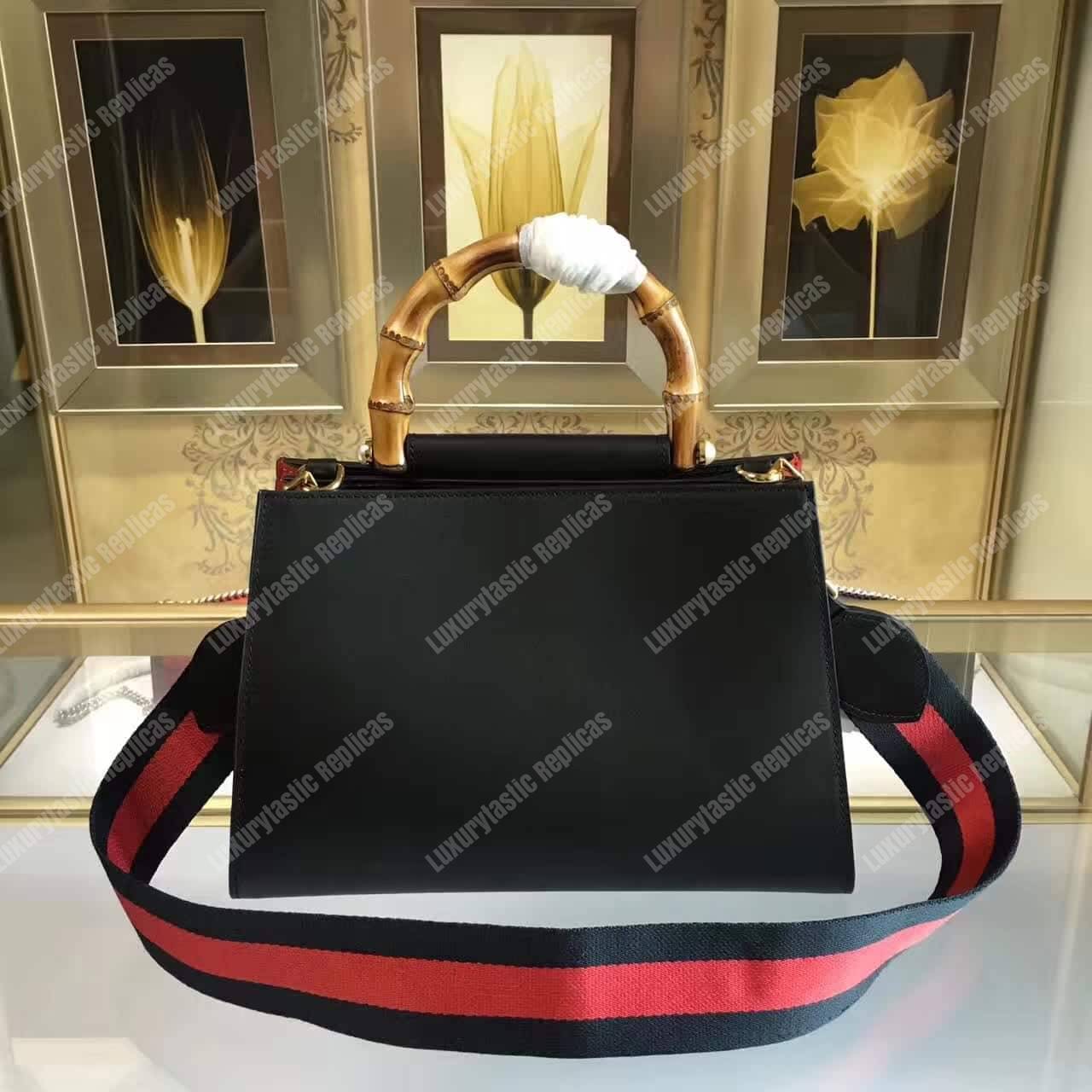 G*u*i nymphaea leather top handle bag