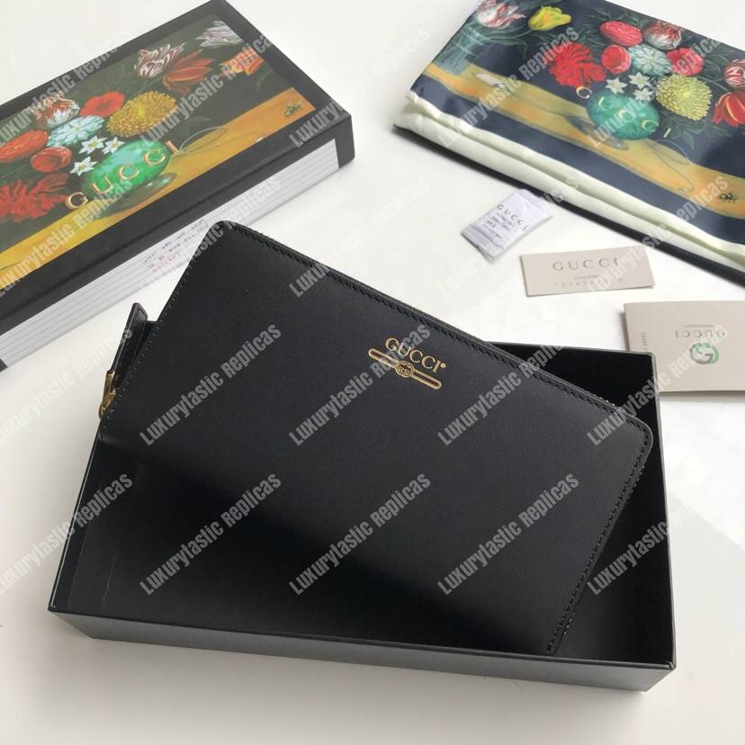 G*u*i leather zip around wallet with G*u*i logo