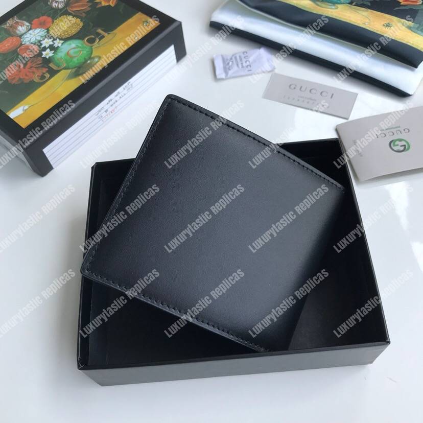 G*u*i leather wallet with G*u*i logo