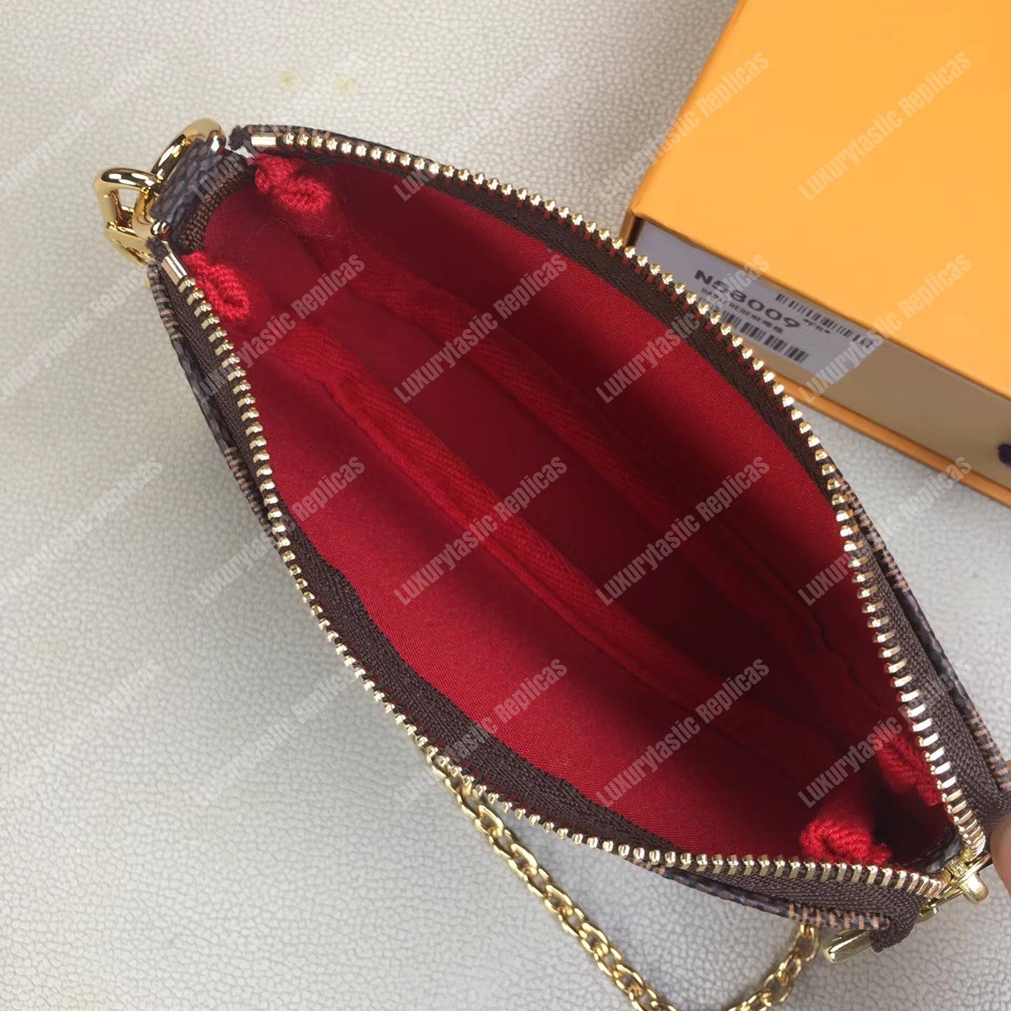 LV Mini Pochette Accessoires Damier Ebene