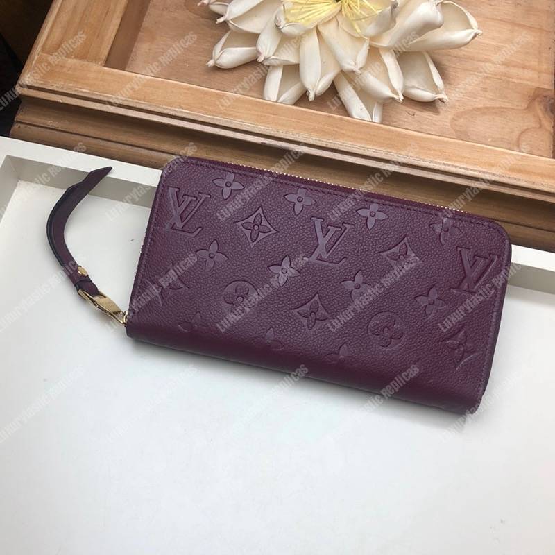 LV Clémence Wallet Monogram Empreinte Leather Raisin