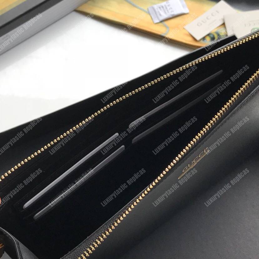 G*u*i leather pouch with G*u*i logo