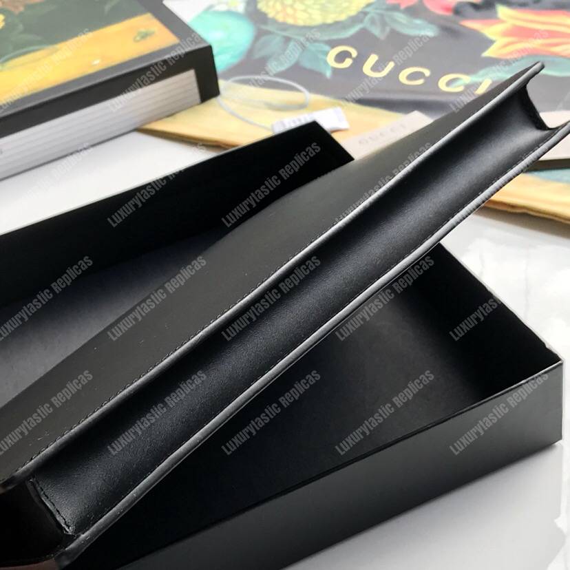 G*u*i leather pouch with G*u*i logo