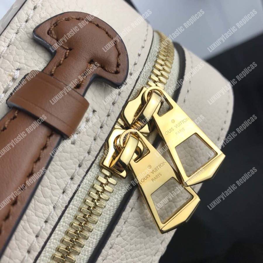 LV Saintonge Monogram Empreinte Leather Creme Caramel