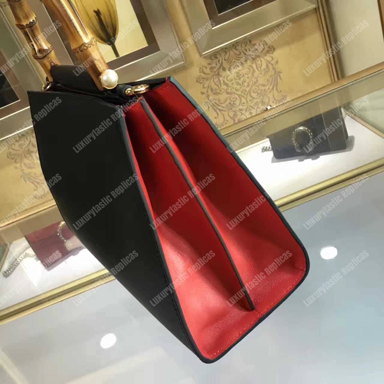 G*u*i nymphaea leather top handle bag