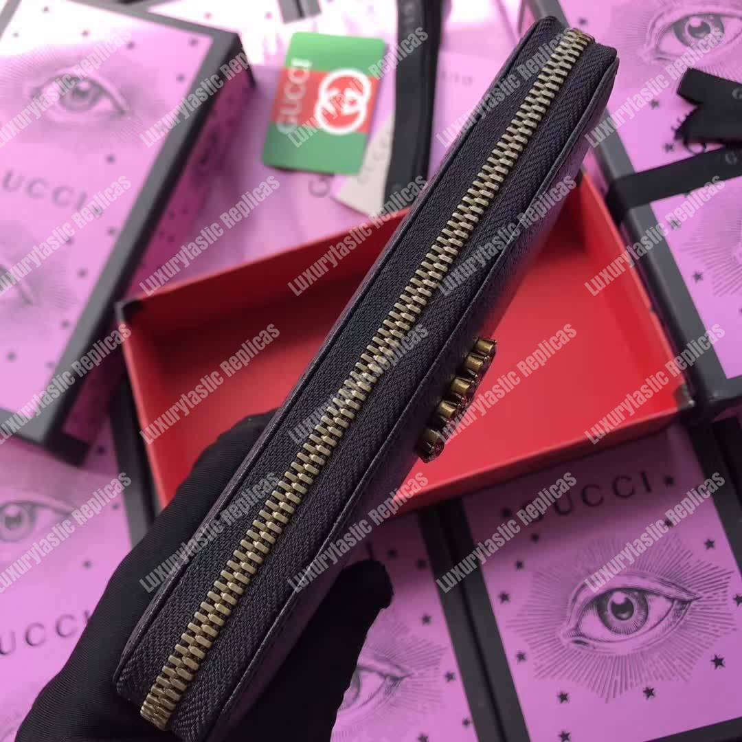 G*u*i leather zip around wallet black