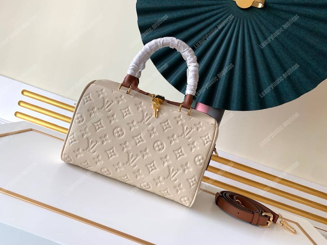 LV Speedy Bandouliere 25 Monogram Empreinte Leather Creme Caramel