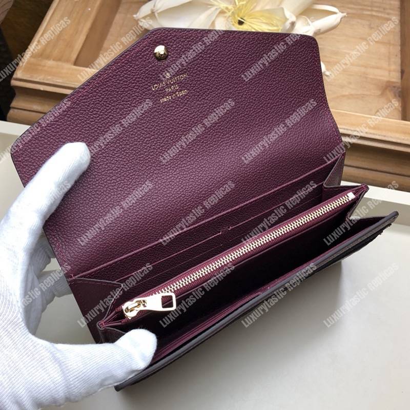 LV Sarah Wallet Monogram Empreinte Leather Raisin Purple