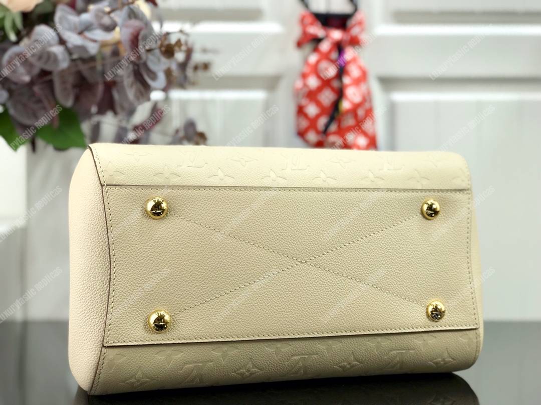 LV Montaigne MM Monogram Empreinte leather Creme