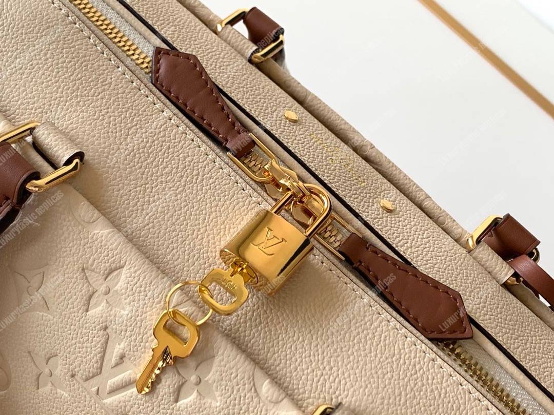 LV Speedy Bandouliere 25 Monogram Empreinte Leather Creme Caramel