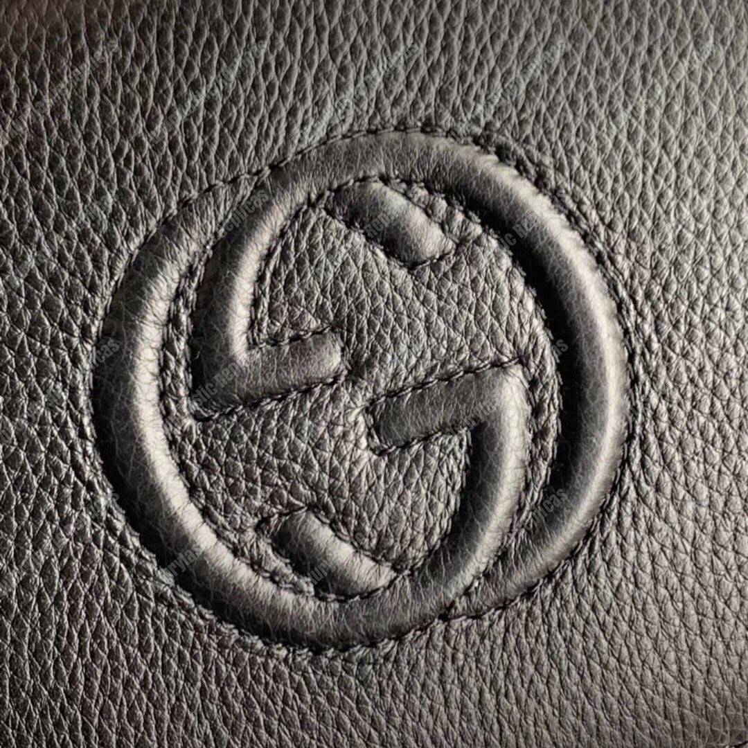 G*u*i pebbled calfskin soho travel document case black