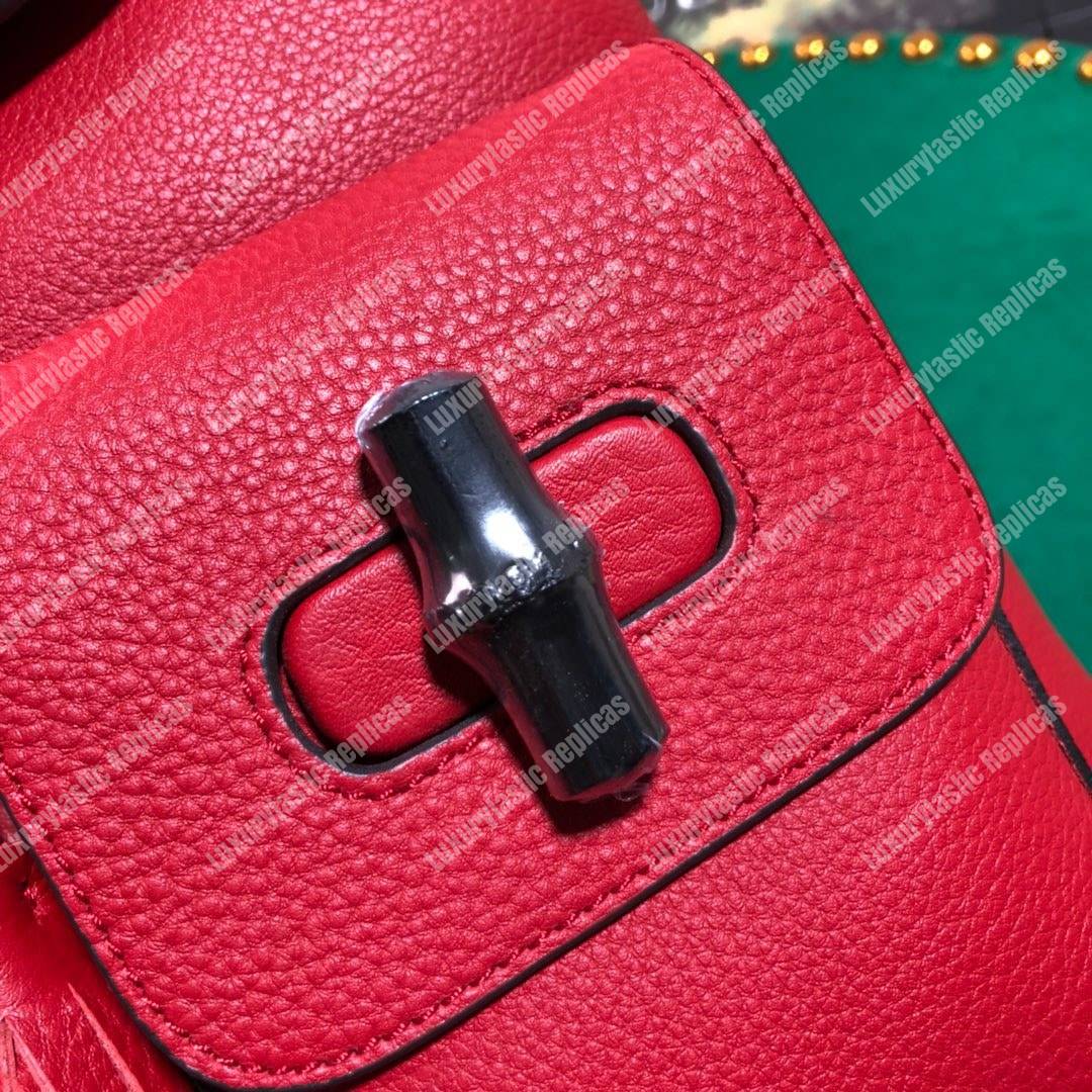 G*u*i leather bamboo tassel backpack hibiscus red