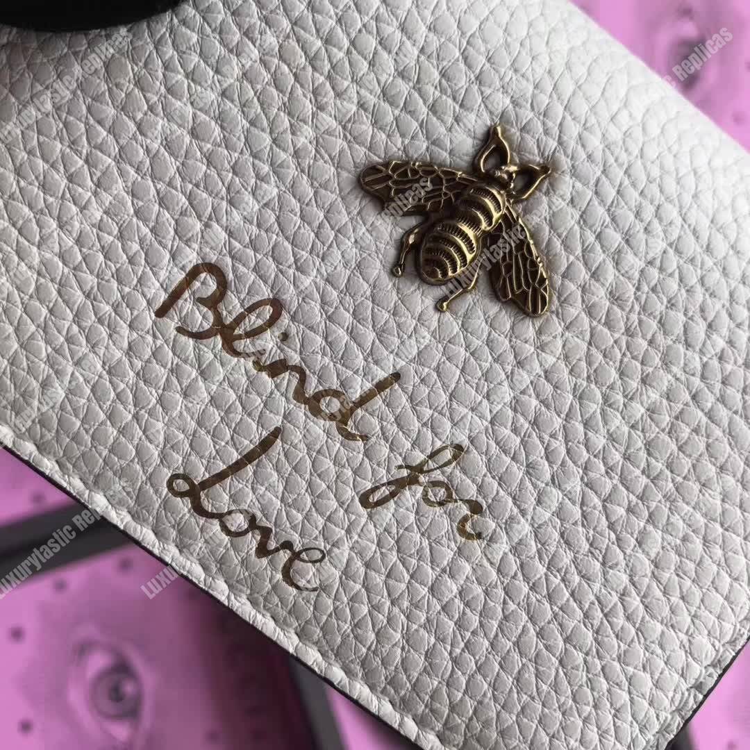 G*u*i animalier card case white with bee