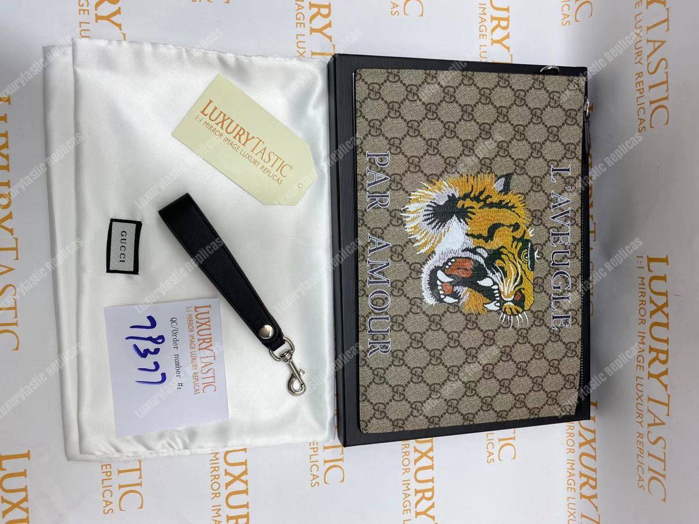 G*u*i tiger print gg sup*e clutch pouch