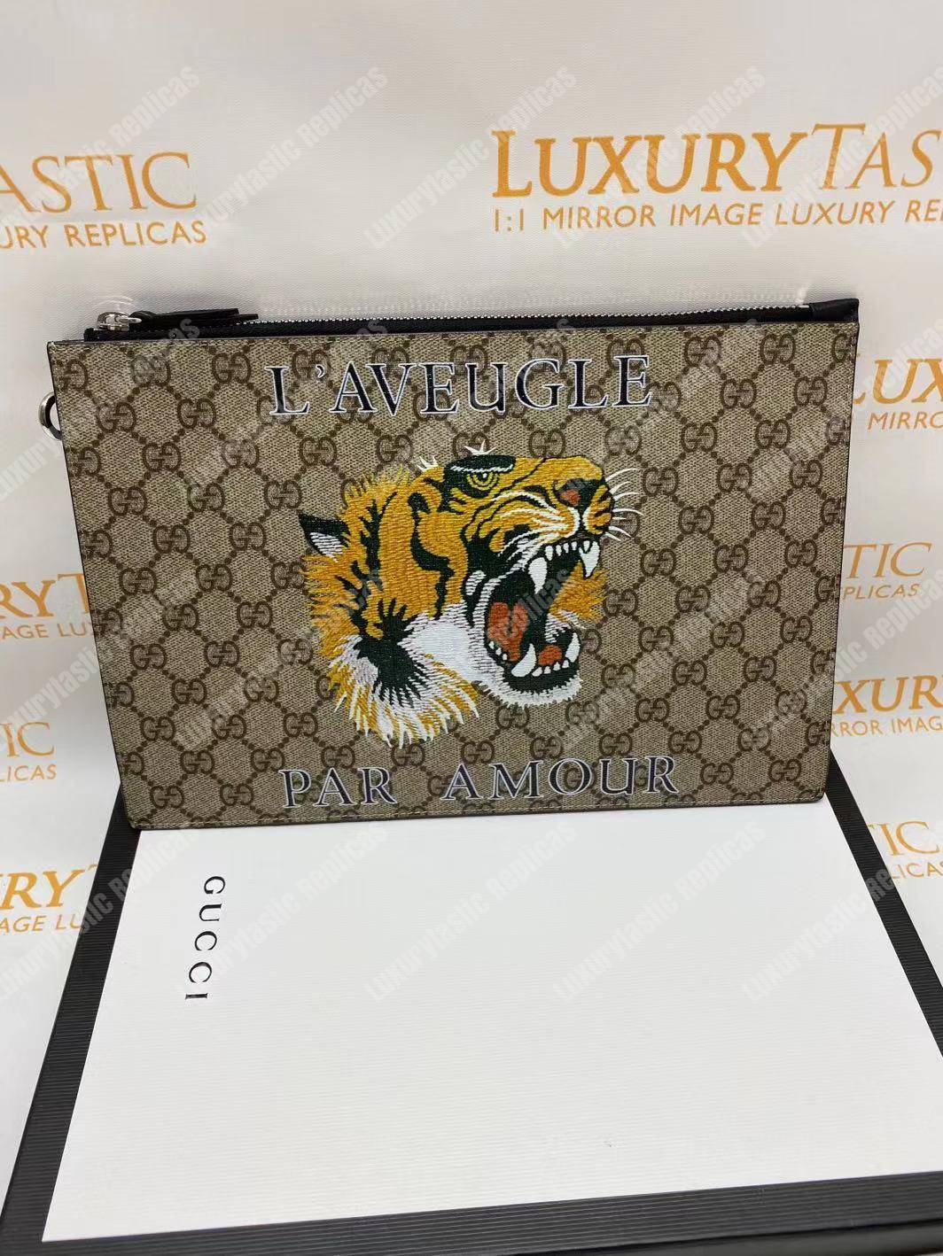 G*u*i tiger print gg sup*e clutch pouch