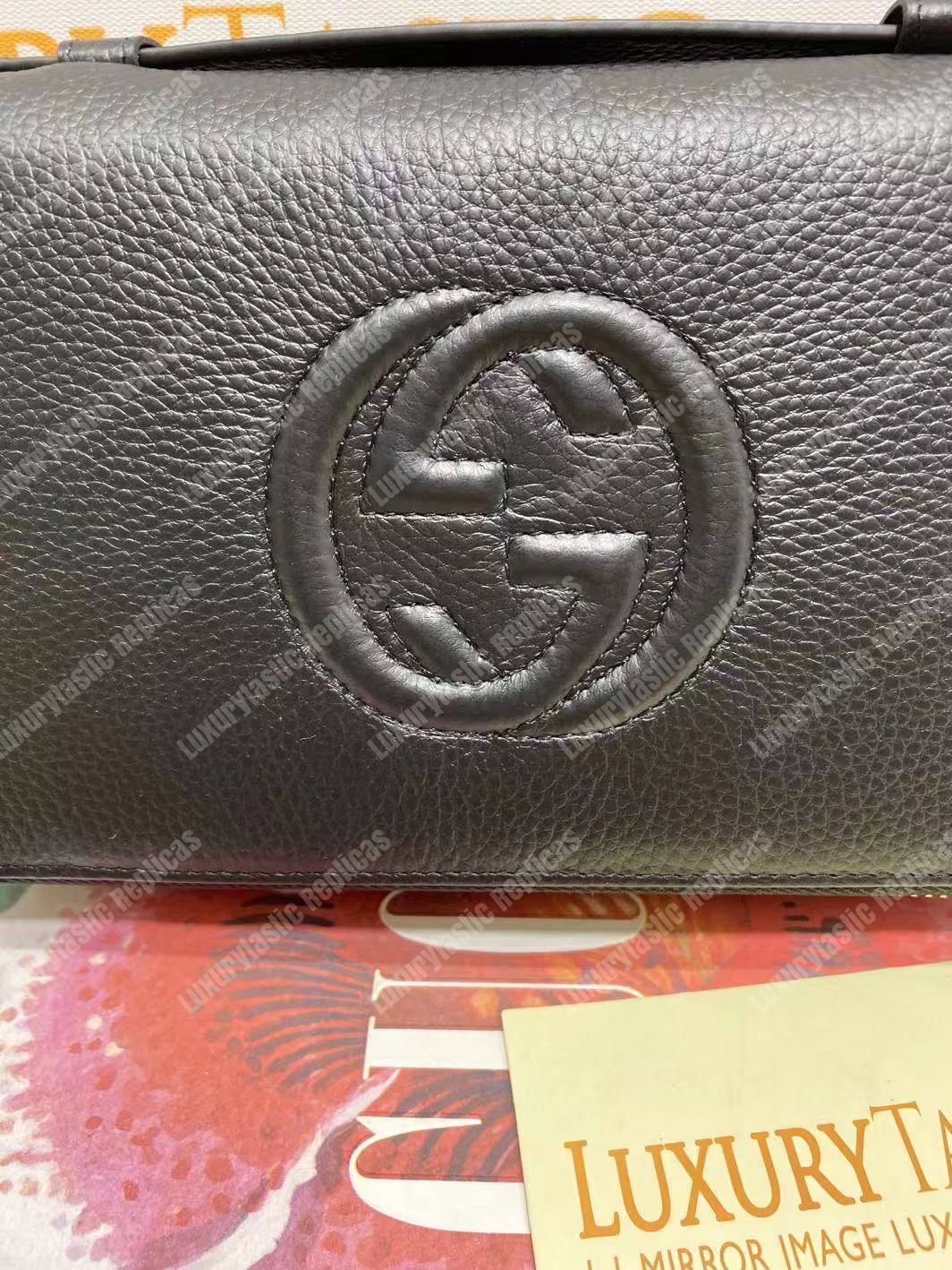 G*u*i pebbled calfskin soho travel document case black