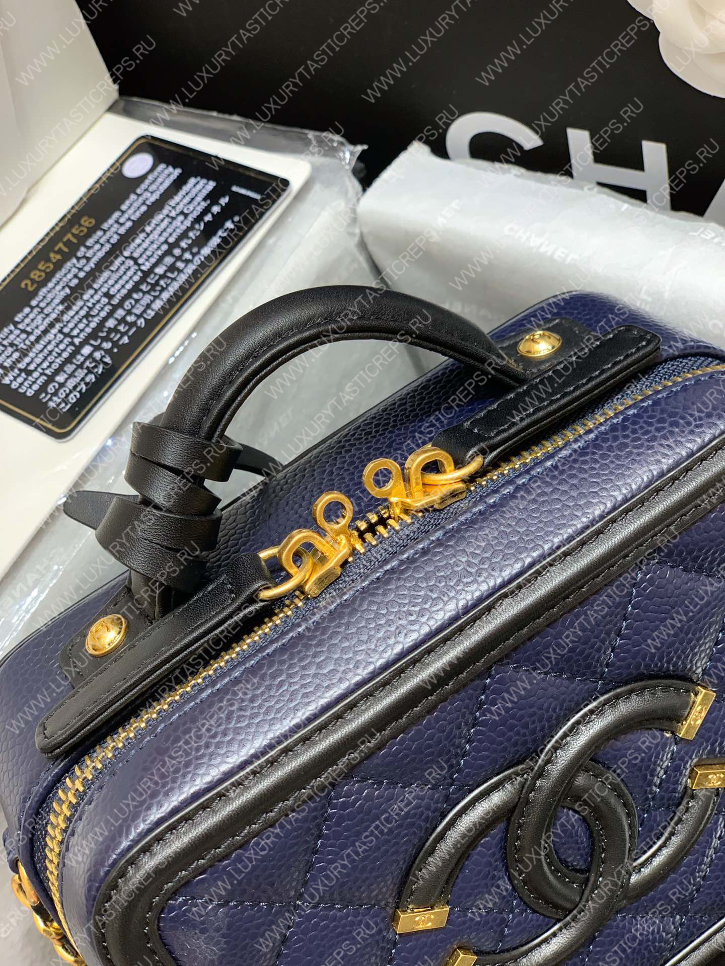 Ch*el vanity case black and blue a93342